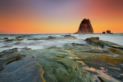 Scenic view of sea against sky during sunset