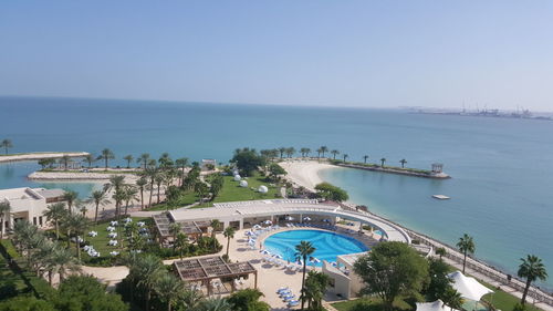 High angle view of swimming pool by sea against sky