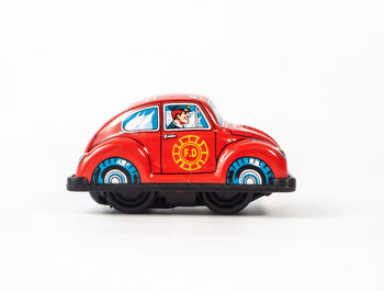 Toy car against white background