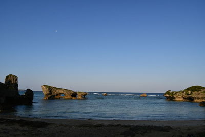 Scenic view of sea against clear sky