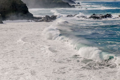 Waves splashing on shore