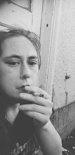 Portrait of man smoking cigarette