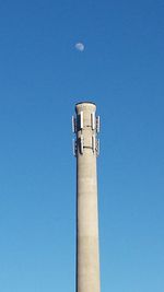 Low angle view of street light against clear blue sky