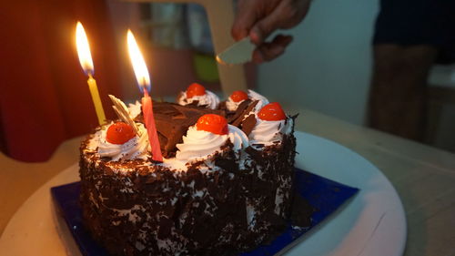 Close-up of lit birthday cake