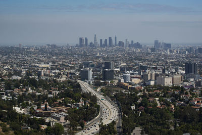 High angle view of modern buildings in city against sky