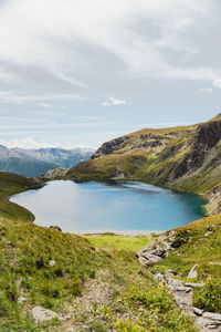 Scenic view of lake and mountains against sky