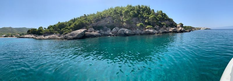 Scenic view of sea against clear blue sky