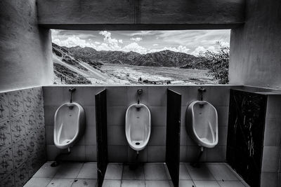 Empty toilet against landscape