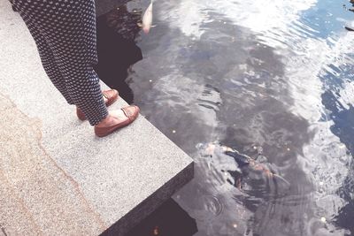 Low section of woman in water