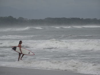 Man surfing in sea