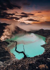 Aerial view of sea against sky during sunset