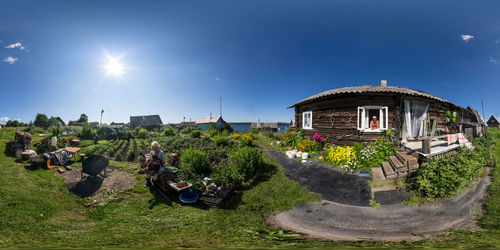 Seamless full spherical 360 degree panorama of rustic house with old man and woman with fat cat