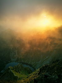 Scenic view of landscape against sky during sunset