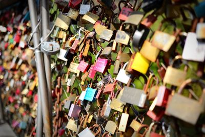 Padlocks hanging on railing