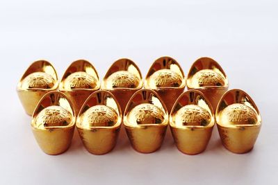 Close-up of ingots against white background