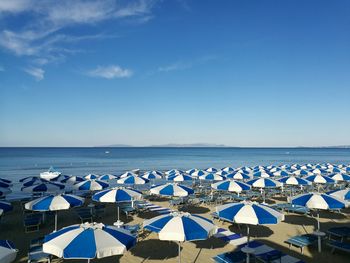 Scenic view of beach against clear blue sky