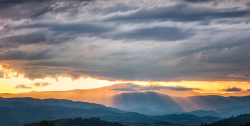 Scenic view of dramatic sky during sunset