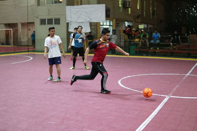 People playing with ball in background