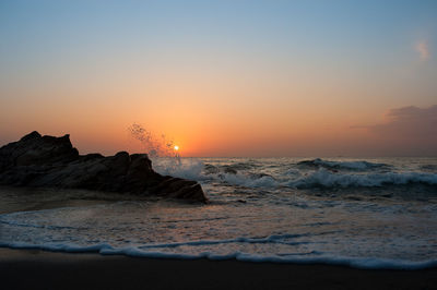 Scenic view of sea against sky during sunset