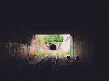 Woman walking in tunnel