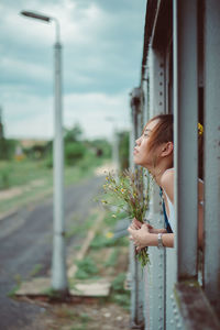 Side view of woman in miniature train