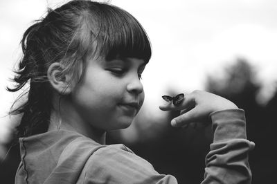 Close-up of boy holding girl