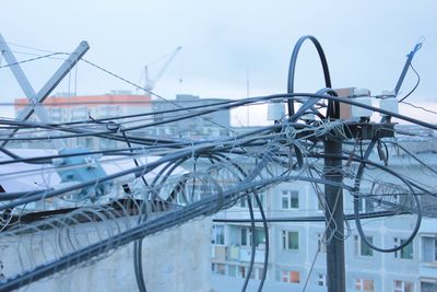 Close-up of telephone poles in city