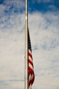 Low angle view of flag against sky