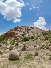 Rock formations on landscape against sky