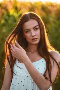 Portrait of young woman wearing hat