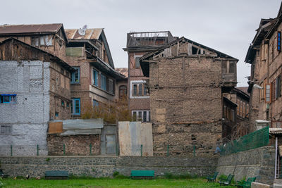 Low angle view of old buildings against sky