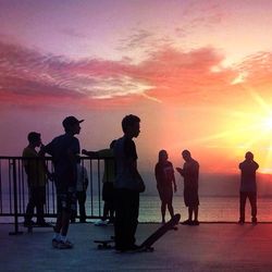 Silhouette of people at sunset