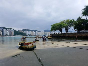 Nautical vessel moored on sea against sky