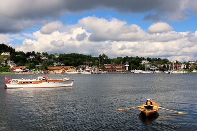 Boats in sea against sky