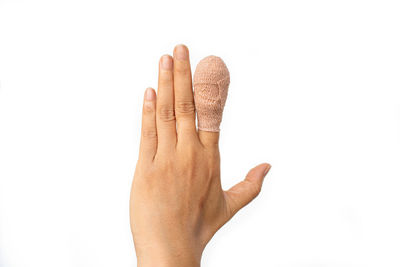 Close-up of human hand against white background