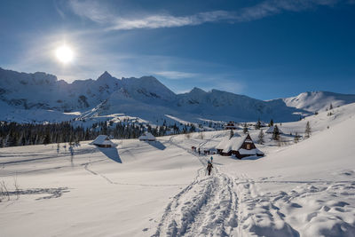 Scenic view of snow covered mountains against sky