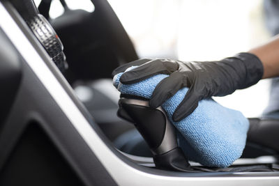 Close-up of hand holding car