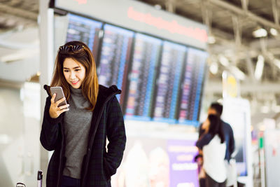 Young woman using mobile phone