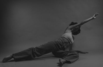 Low section of woman standing against sky