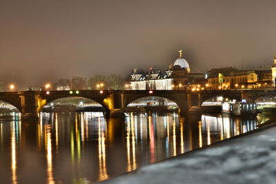 Reflection of illuminated buildings in water