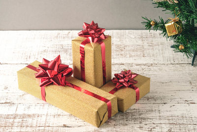 High angle view of christmas presents on wooden table