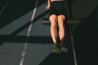 Low section of woman standing on floor