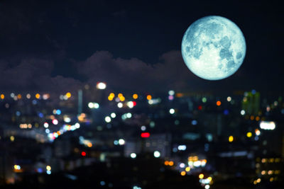 View of illuminated city against sky at night