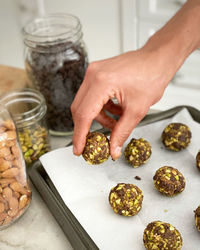 Midsection of person preparing food on table