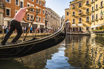 Canal amidst buildings in city