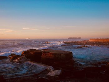 Scenic view of sea against sky during sunset