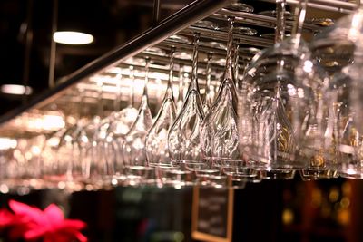 Low angle view of glasses hanging in restaurant