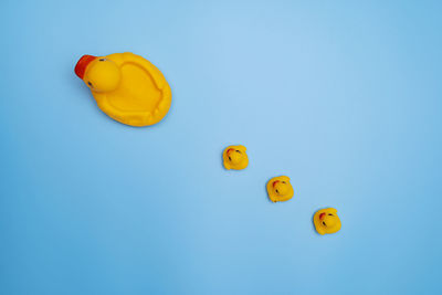 High angle view of yellow toys on table