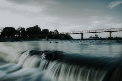 Bridge over river against sky