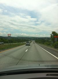 Road seen through car windshield